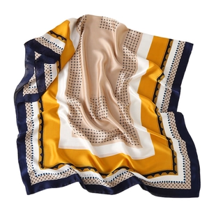 Elegant geometric patterned faux silk scarf in mustard and navy blue, stylish satin shawl