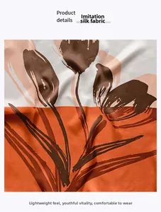 Gros plan détaillé du tissu en soie d'imitation à motif floral orange et blanc