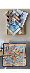 Detailed flat lay of floral pattern satin silk square scarves with stylish sunglasses