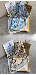 Detailed view of vintage floral silk scarves in blue and mustard yellow patterns
