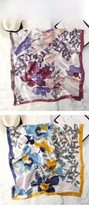 Detailed close-up of floral print scarves showing fine hem and silky texture detail