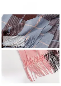 Close-up of soft plaid and solid pink scarves showing fine weave texture and delicate tassels