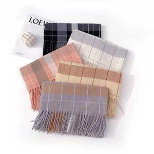 British plaid cashmere scarves with fringe details in various elegant color palettes