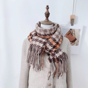 Houndstooth check scarf for winter in orange and beige with stylish long tassels