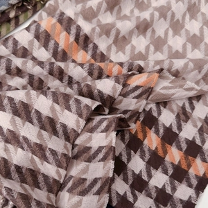 Classic houndstooth scarf in chocolate brown and sunset orange with soft thick texture