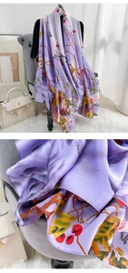 Detail of purple floral silk scarf showing soft texture and elegant printed pattern