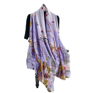 Elegant floral print silk scarf in lavender with white magnolia pattern on mannequin