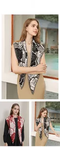 Detail view of a vintage rose print shawl with soft chiffon texture in two color schemes