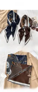 Detail of printed silk-like neck scarf featuring astrology pattern and herringbone edges