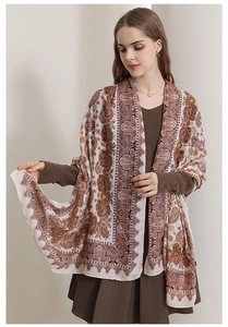 Detail of vintage cotton linen scarf with paisley patterns draped over shoulders