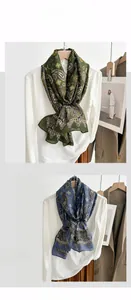Detail of vintage paisley pattern on breathable cotton linen scarves in green and blue