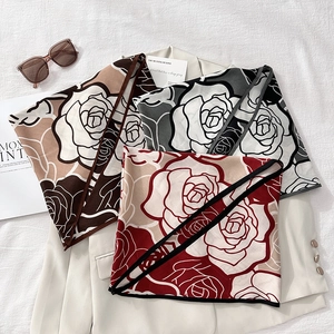 Elegant vintage rose print triangle scarves set displayed on a beige suit blazer