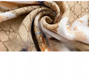 Macro detail of luxury patterned scarf fabric with soft silk texture and elegant drape