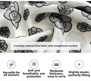 Close-up of camellia print scarf fabric showing breathable and elastic texture detail
