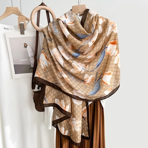 Elegant floral print shawl with geometric patterns and lightweight earth tone fabric