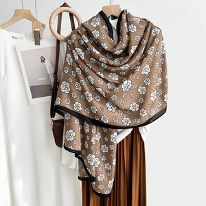 Elegant camel scarf with black camellia floral print and contrast border for women