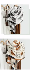 Detailed view of camellia print scarves with artistic floral patterns and lightweight texture