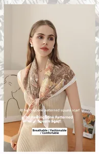 Detail of 90cm herringbone square scarf with plant motifs worn as a neckerchief