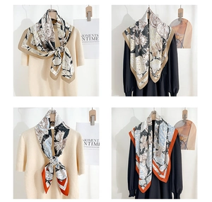 Detail of artistic floral silk scarf with vintage prints and elegant borders
