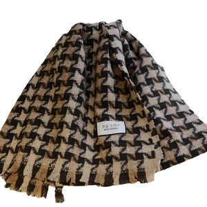 Classic houndstooth scarf with tassels in brown and beige colors for winter fashion