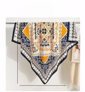 Detail of 90cm square scarf with vintage paisley print and navy blue rolled edges