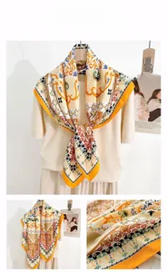 Detail of bohemian vintage silk scarf with baroque floral patterns and dots