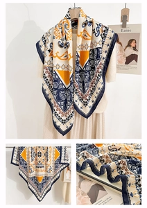 Detail of bohemian retro paisley print square scarf with navy and orange floral patterns