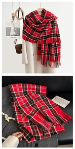 Detailed view of red and black plaid cashmere-like scarf with soft handmade tassels