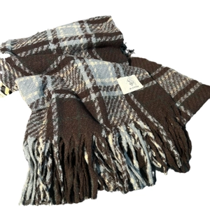 Classic checkered wool scarf in blue and brown with tassel trim for winter warmth