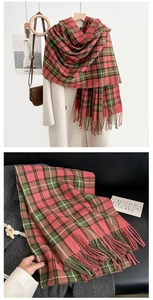 Close-up of pink and green plaid scarf with soft fringe and thick cashmere texture