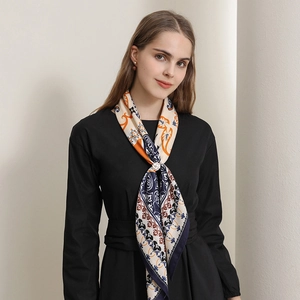 Bohemian retro printed square scarf in navy and orange with a floral brooch accessory
