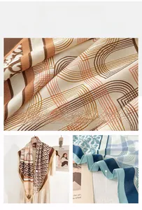 Detailed view of herringbone silk scarf with monogram print and refined hem stitching