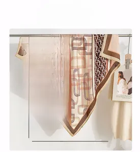 Detail of 90cm vintage herringbone silk scarf with chain print on a display stand
