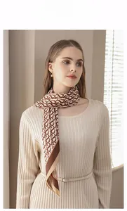 Elegant woman wearing a silk scarf with vintage letter print and ivory knitted dress
