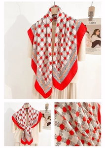 Detail of elegant chain print silk scarf with geometric red patterns and texture