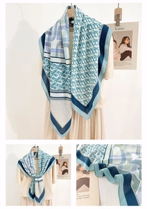 Detailed view of the elegant geometric blue pattern and lightweight fabric of the shawl