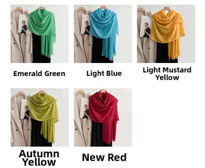 Detailed close-up of solid color cotton linen scarves with tassels in five various colors