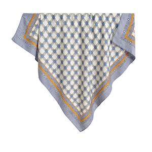 Elegant silk-like scarf with blue geometric patterns and orange border in diagonal display