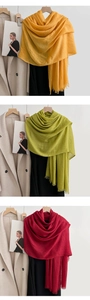 Detailed texture of cotton linen scarves with frayed edges and pleated fabric in multiple colors
