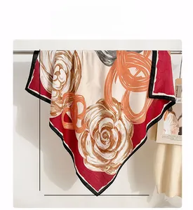 Detail of 90cm square silk scarf with vintage floral patterns and contrast rolled edges