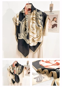 Close-up of elegant floral print silk scarf with large roses and khaki border detail