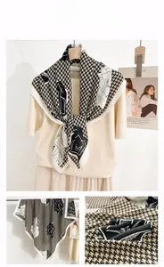Detailed view of square scarf with houndstooth and abstract floral print patterns