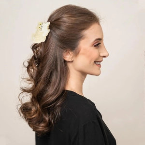 Cute cream-white cat hair claw clip shown on a model for half-up hair styling