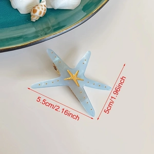 Blue starfish hair clip with gold dots and metal hairpins for summer beach style
