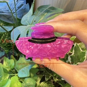 Detailed view of purple witch hat hair claw with unique texture and size 7.5cm x 5.5cm