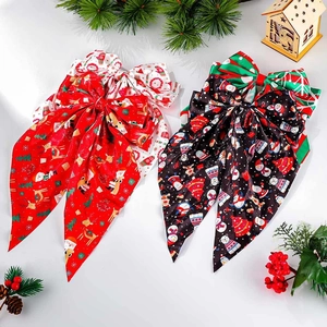Christmas bow hair clips with reindeer and Santa prints on premium satin ribbons
