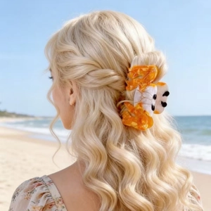 Creative large orange crab hair claw clip for beach vacation styling on blonde hair