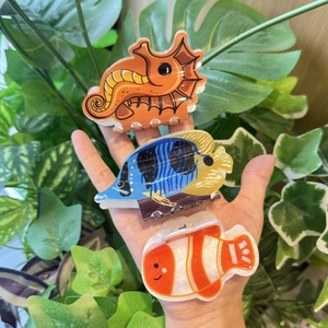 Cute ocean animal hair claw clips set featuring seahorse and tropical fish designs
