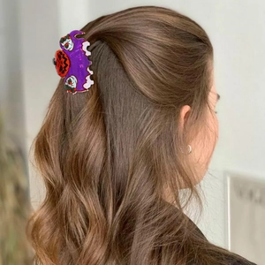 Pince à cheveux Halloween avec motif citrouille et clown maléfique sur base violette