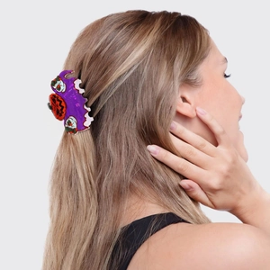 Pince à cheveux Halloween avec motif citrouille et fantôme sur accessoire violet